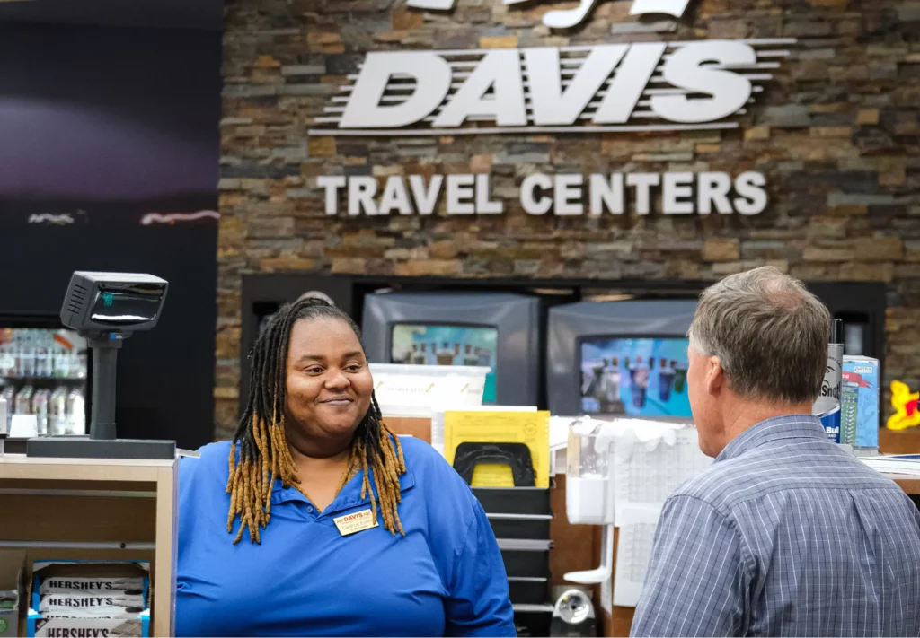 Employee of Davis Travel Centers speaking with a customer