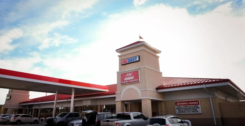 A view of Davis Travel Center with blue sky and clouds above